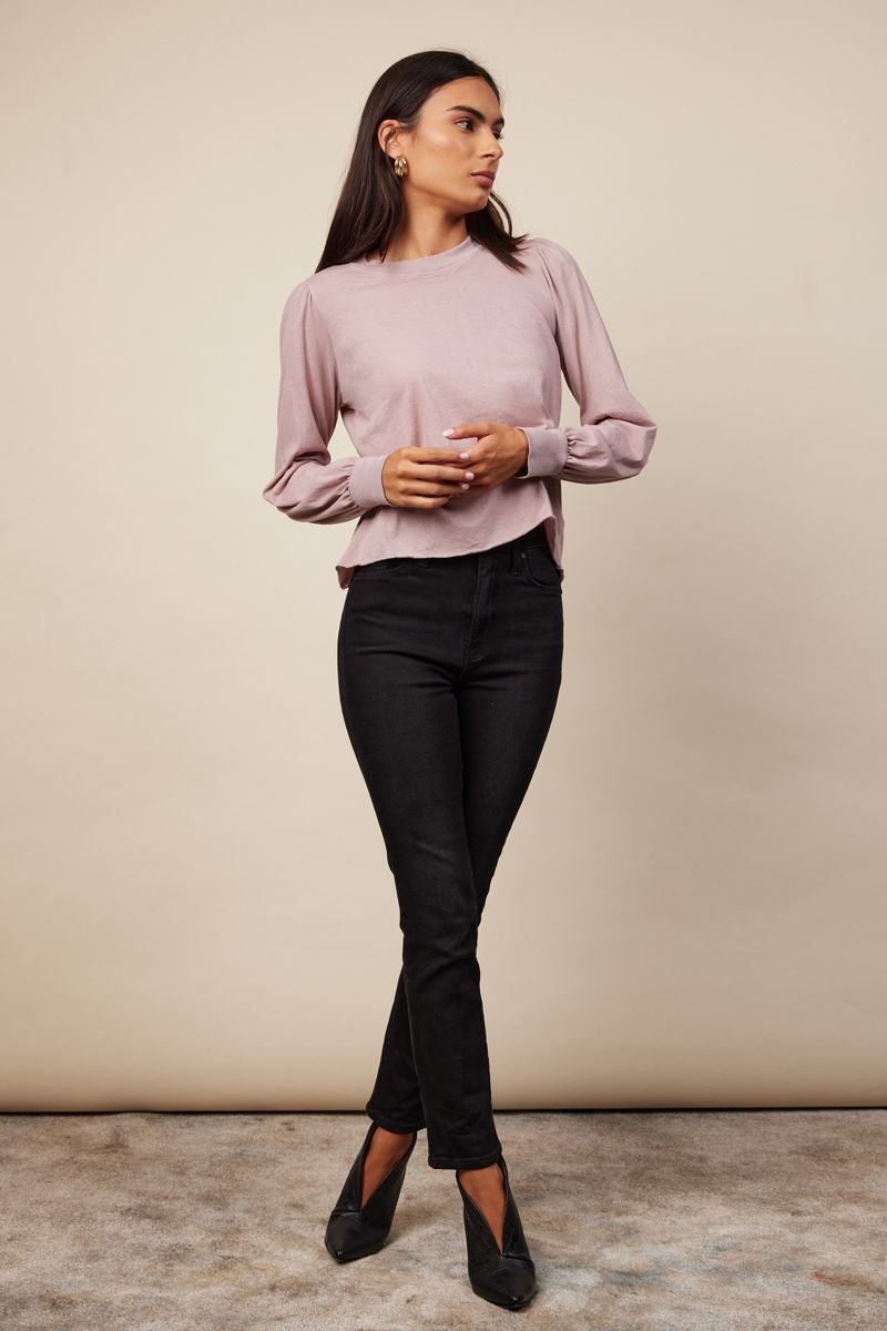 woman standing in slight puff sleeve with ribbed wrist in nude