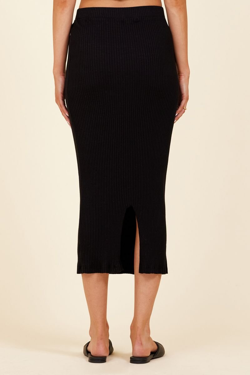 back of midi length ribbed skirt in black with slit