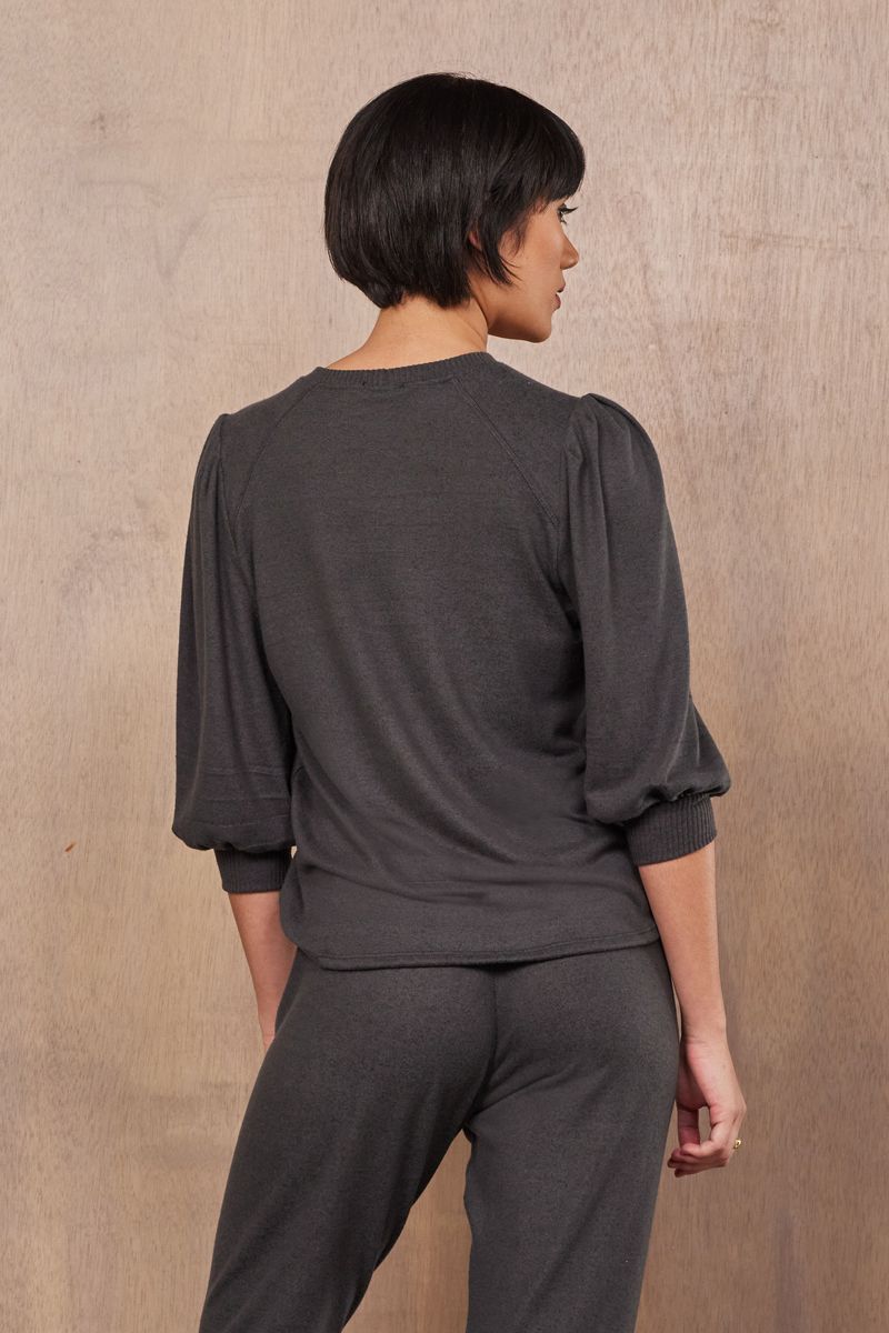 back of half length puff sleeve blouse in dark green