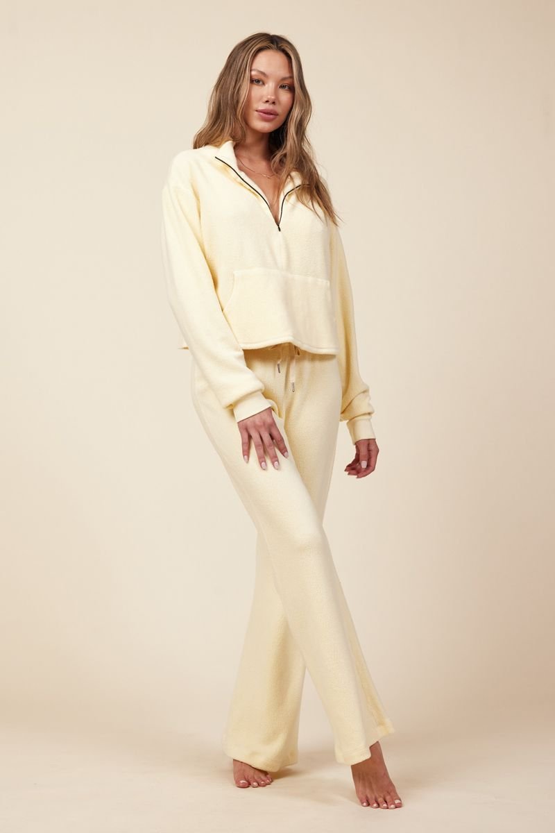 model standing in light yellow sherpa set
