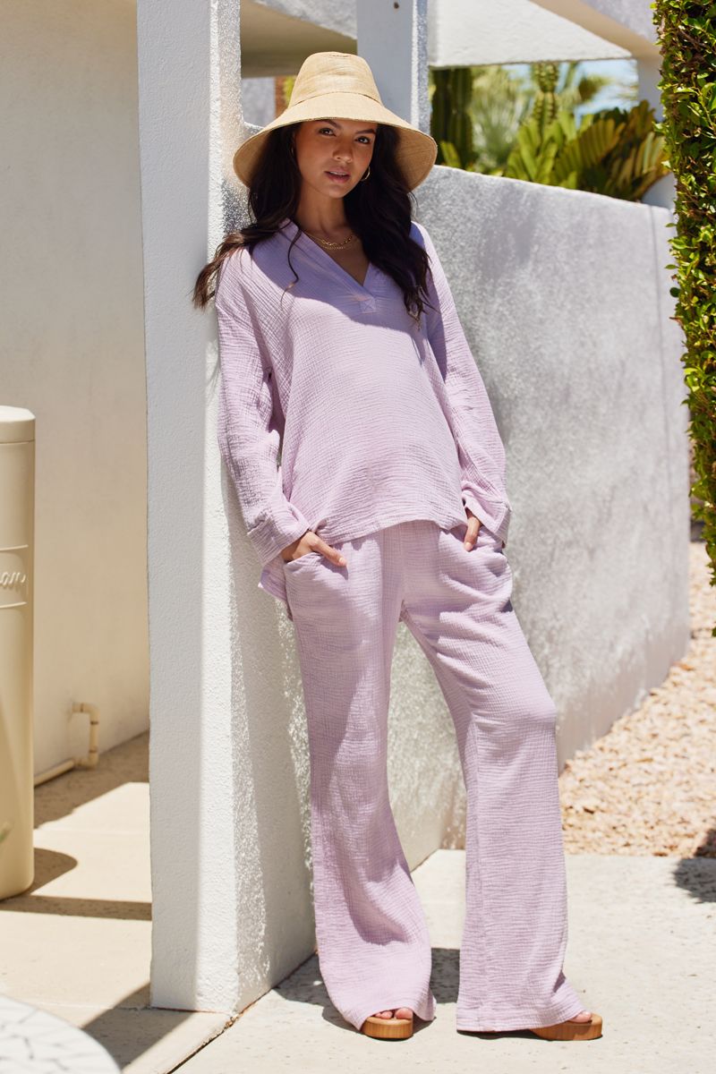 woman on a patio in light purple gauze set