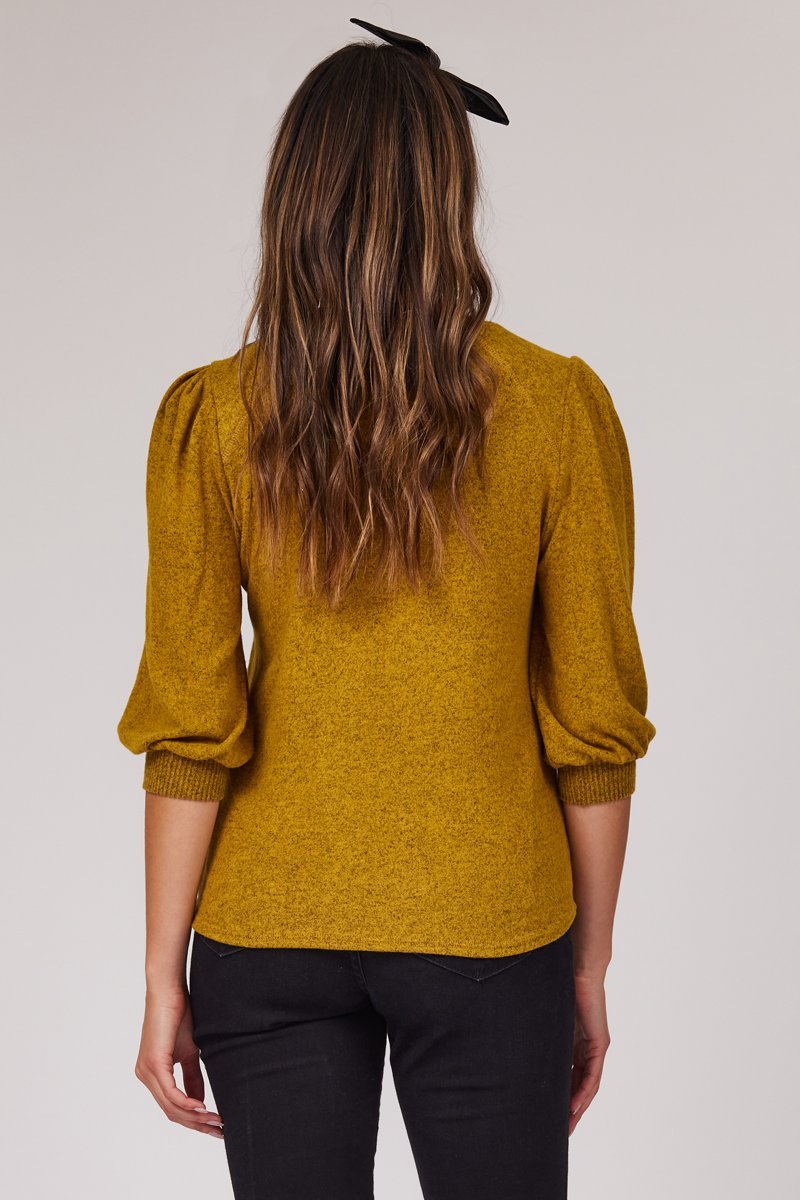 back of half length yellow puff sleeve blouse
