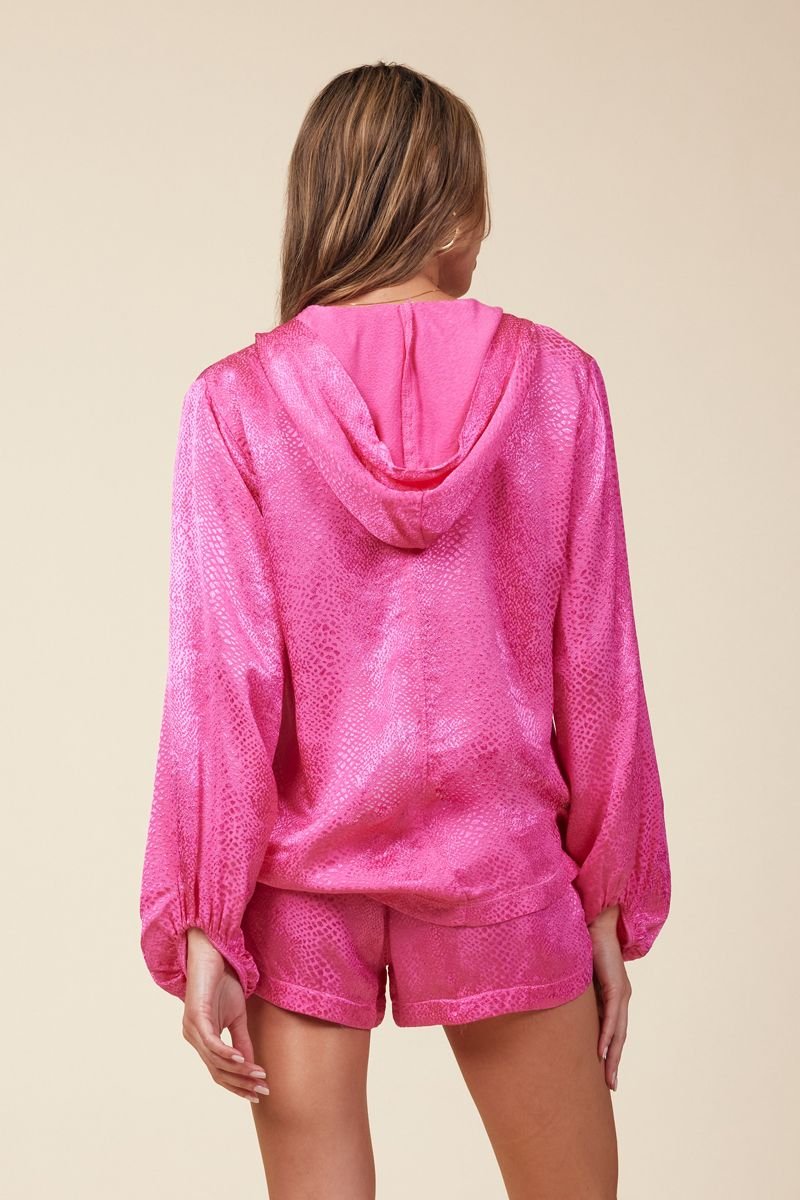 back of hot pink hoodie with a bell sleeve  in a snake print jacquard